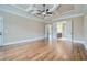 Spacious main bedroom featuring a tray ceiling and hardwood floors, seamlessly connecting to the ensuite bathroom at 631 Mabry Rd, Sandy Springs, GA 30328