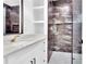 Stylish bathroom featuring a modern shower with sleek fixtures, and a white vanity with countertop at 801 Braselton Hwy, Lawrenceville, GA 30043