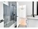 Bathroom featuring a glass-enclosed shower, a tub, and a white vanity with countertop at 801 Braselton Hwy, Lawrenceville, GA 30043