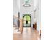 Grand foyer boasts soaring ceilings, modern chandelier, and beautiful hardwood floors at 801 Braselton Hwy, Lawrenceville, GA 30043