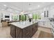 Modern kitchen with island, stainless steel appliances and connected living space at 801 Braselton Hwy, Lawrenceville, GA 30043
