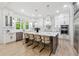 Spacious kitchen featuring marble countertops, stainless appliances, stylish island, and modern finishes at 801 Braselton Hwy, Lawrenceville, GA 30043
