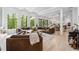 Comfortable living room featuring large windows, hardwood floors, sofas, and an open floorplan at 801 Braselton Hwy, Lawrenceville, GA 30043