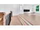 Bright living room featuring a modern fireplace, custom shelving, and sleek hardwood floors, creating an inviting atmosphere at 801 Braselton Hwy, Lawrenceville, GA 30043