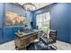 Well-appointed home office with custom desk, unique decor, and ample natural light at 801 Braselton Hwy, Lawrenceville, GA 30043