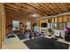 Unfinished basement featuring home gym equipment and rubber flooring, perfect for a workout space at 1186 Lincoln Dr, Marietta, GA 30066