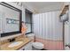 Bathroom with granite countertop vanity, and shower with neutral tile at 1186 Lincoln Dr, Marietta, GA 30066