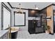 A modern bathroom boasts an elegant black freestanding tub and a glass enclosed shower with gold hardware at 1186 Lincoln Dr, Marietta, GA 30066