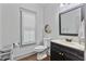 Charming half bathroom features modern fixtures, vanity with mirror, and plantation shutters at 1186 Lincoln Dr, Marietta, GA 30066