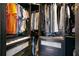 A dark wooden closet has ample storage and drawers with gold hardware to provide a functional and organized space at 1186 Lincoln Dr, Marietta, GA 30066