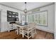 Bright dining area with plantation shutters, decorative lighting, and farmhouse-style table with seating at 1186 Lincoln Dr, Marietta, GA 30066