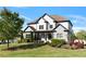 Beautifully landscaped front yard with a charming two-story home and a manicured lawn at 1186 Lincoln Dr, Marietta, GA 30066