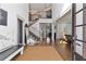 Grand foyer with a striking staircase, hardwood floors, and abundant natural light at 1186 Lincoln Dr, Marietta, GA 30066