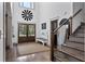 Welcoming foyer showcasing hardwood floors, a decorative bench, and an elegant staircase at 1186 Lincoln Dr, Marietta, GA 30066