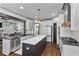 Beautiful kitchen featuring a large center island, stainless steel appliances, and dark hardwood floors at 1186 Lincoln Dr, Marietta, GA 30066