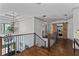 Second floor landing featuring hardwood floors and wrought iron stair railing at 1186 Lincoln Dr, Marietta, GA 30066
