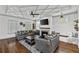 Comfortable living room with coffered ceilings, fireplace, large screen tv, and stylish furnishings at 1186 Lincoln Dr, Marietta, GA 30066
