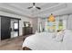 Elegant main bedroom featuring dark wooden furniture, tray ceilings and large windows at 1186 Lincoln Dr, Marietta, GA 30066