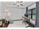 Bright home office with large window, modern desk, and comfortable seating area at 1186 Lincoln Dr, Marietta, GA 30066