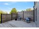 Enjoy outdoor living on this cozy patio with seating and a stylish privacy fence at 1186 Lincoln Dr, Marietta, GA 30066