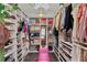 A walk-in closet features ample storage and a pink velvet chaise under a floral ceiling decoration at 1186 Lincoln Dr, Marietta, GA 30066