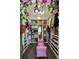 A walk-in closet features ample storage and a pink velvet chaise under a floral ceiling decoration at 1186 Lincoln Dr, Marietta, GA 30066