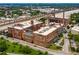 This is an aerial view of the brick apartment complex with trees, roads and smokestacks at 170 Boulevard Se # H405, Atlanta, GA 30312