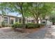 Landscaped community courtyard with wooden bench and mature trees with brick buildings at 170 Boulevard Se # H405, Atlanta, GA 30312