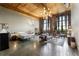 Loft-style living area with wood-beamed ceilings, exposed brick, and an open layout with bedroom and living spaces at 170 Boulevard Se # H405, Atlanta, GA 30312