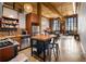 Open-concept living area with exposed brick, wood ceilings, and a well-appointed kitchen in a modern loft setting at 170 Boulevard Se # H405, Atlanta, GA 30312