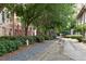 Tranquil path showcasing lush landscaping, brick structures and walking path in the community at 170 Boulevard Se # H405, Atlanta, GA 30312