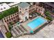 An inviting community pool is surrounded by lounging chairs within historic brick structure at 170 Boulevard Se # H405, Atlanta, GA 30312