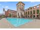 Relaxing pool setting within unique brick structure with several lounge chairs and umbrellas at 170 Boulevard Se # H405, Atlanta, GA 30312