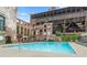 Resort style community pool within brick buildings offering shady areas for relaxing at 170 Boulevard Se # H405, Atlanta, GA 30312