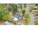 Aerial view of a home with an expansive backyard, a deck, and mature trees at 4581 Hickory Run Nw Ct, Acworth, GA 30102