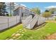 Backyard featuring a large white deck, steps leading to the yard, and green grass at 4581 Hickory Run Nw Ct, Acworth, GA 30102