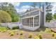 Well-maintained backyard featuring a screened porch, a deck, and landscaped surroundings at 4581 Hickory Run Nw Ct, Acworth, GA 30102