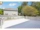 The backyard features a deck great for relaxation and entertaining, nestled among mature trees at 4581 Hickory Run Nw Ct, Acworth, GA 30102