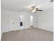Spacious bedroom featuring neutral carpet, a ceiling fan, and an ensuite bathroom at 4581 Hickory Run Nw Ct, Acworth, GA 30102