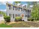 Inviting two-story gray home with manicured front yard and cozy front porch at 4581 Hickory Run Nw Ct, Acworth, GA 30102