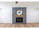 Elegant fireplace with decorative mantel, modern design, and hardwood floors at 4581 Hickory Run Nw Ct, Acworth, GA 30102