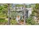 Charming home with a welcoming front porch, dormer windows, and mature trees in a lush setting at 4581 Hickory Run Nw Ct, Acworth, GA 30102