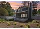 Charming home featuring a screened porch and backyard deck with a beautifully landscaped yard at 4581 Hickory Run Nw Ct, Acworth, GA 30102
