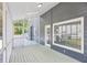 View of the screened porch with access to the backyard, great for outdoor relaxation at 4581 Hickory Run Nw Ct, Acworth, GA 30102