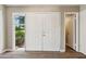 Inviting foyer featuring double doors, wood-look flooring, and a view to the outside at 553 Candlewood Dr, Stone Mountain, GA 30088