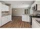 Bright kitchen featuring white cabinets, modern appliances, and open layout, perfect for entertaining at 553 Candlewood Dr, Stone Mountain, GA 30088