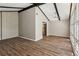 Bright living area with vaulted ceilings, wood beams, and large windows for abundant natural light at 553 Candlewood Dr, Stone Mountain, GA 30088