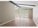 Spacious living room featuring vaulted ceilings, modern floors, and bright, natural light at 553 Candlewood Dr, Stone Mountain, GA 30088