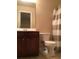 Bathroom with a vanity, toilet, and a shower curtain at 1186 Ridenour Blvd # 5, Kennesaw, GA 30152