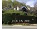Beautiful Ridenour neighborhood sign with mature landscaping and greenery at 1186 Ridenour Blvd # 5, Kennesaw, GA 30152